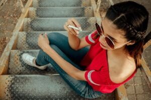 Woman sat on steps smoking